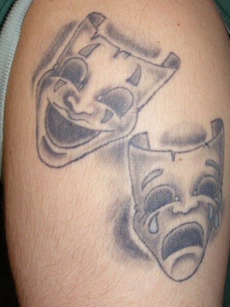 Comedy and tragedy mask matching tattoos by André de