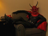 The Krampus Devil lounges, awaiting his followers to join hi